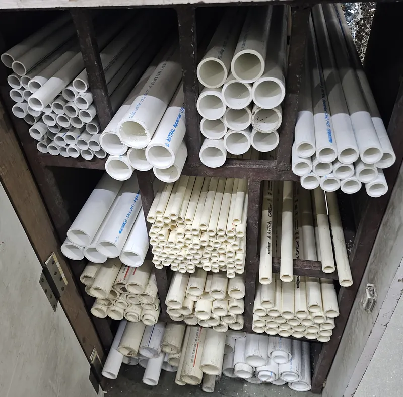 Rack of Astral CPVC Pro and Astral Aquarius uPVC pipes in several diameters at Mahalaxmi Hardware and Electricals, Kothrud